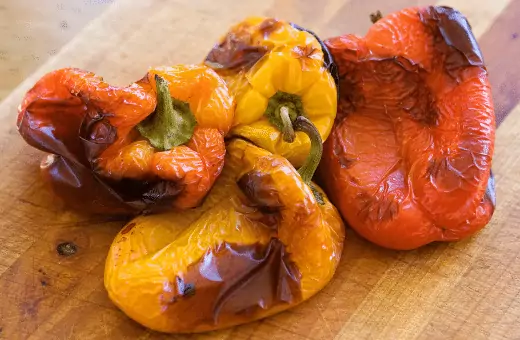 the image contains three roasted peppers which are another substitute for sun-dried tomatoes.