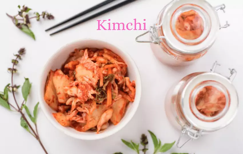kimchi, a popular fermented dish in korea, is made with napa cabbage, radish, green onion, garlic, and gochujang, which is mixed with rice flour.