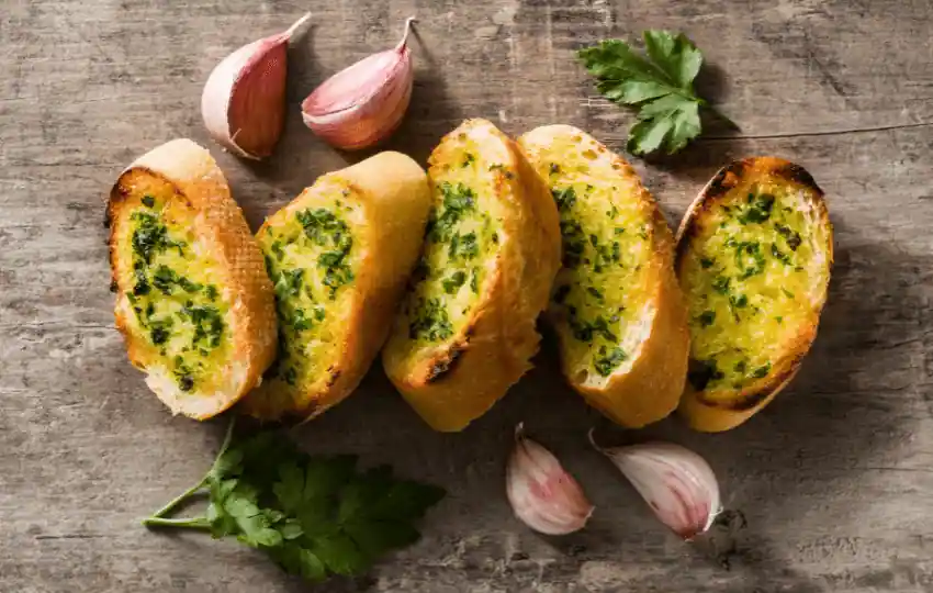 garlic bread is typically a type of Italian or French bread toasted with garlic butter and herbs
