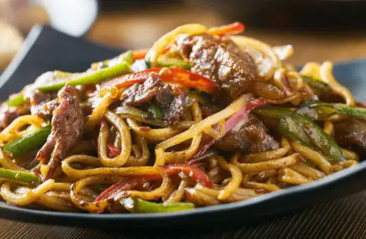 Yakisoba is made from wheat flour, which gives it a chewy texture and nutty flavor that's similar to lo mein noodles. 